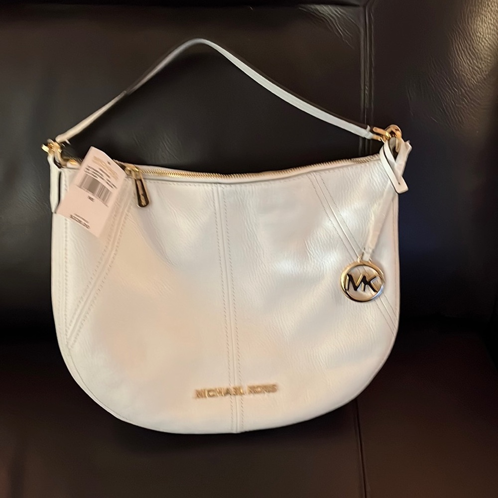 White Michael Kors white handbag, 10x13, Price tag attached, never used. Leather